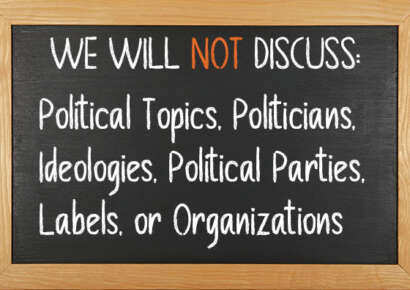 Chalkboard that reads "We will not discuss political topics, politicians, ideologies, political parties, labels, or organizations